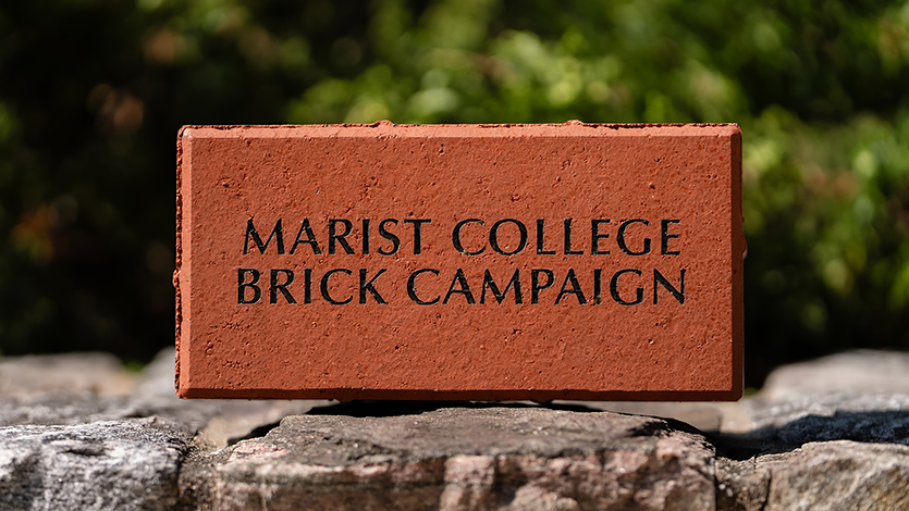 An image of a brick that says Marist College. 