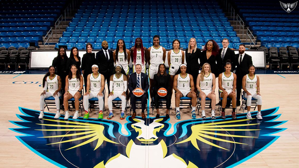 An image of Greg Bibb, Marist College Class of 1996, president and CEO of the WNBA's Dallas Wings, pictured with the team in 2022.