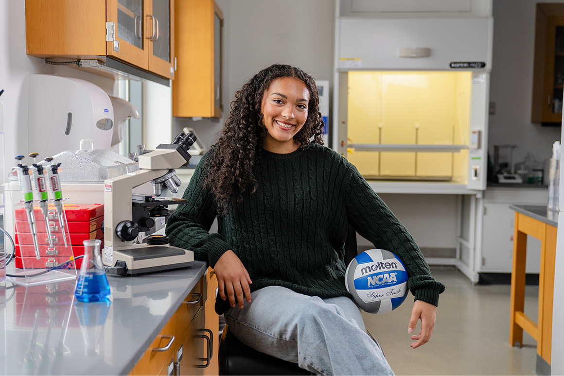 Vallane Sneva ’27 poses for a portrait in the biology lab on campus