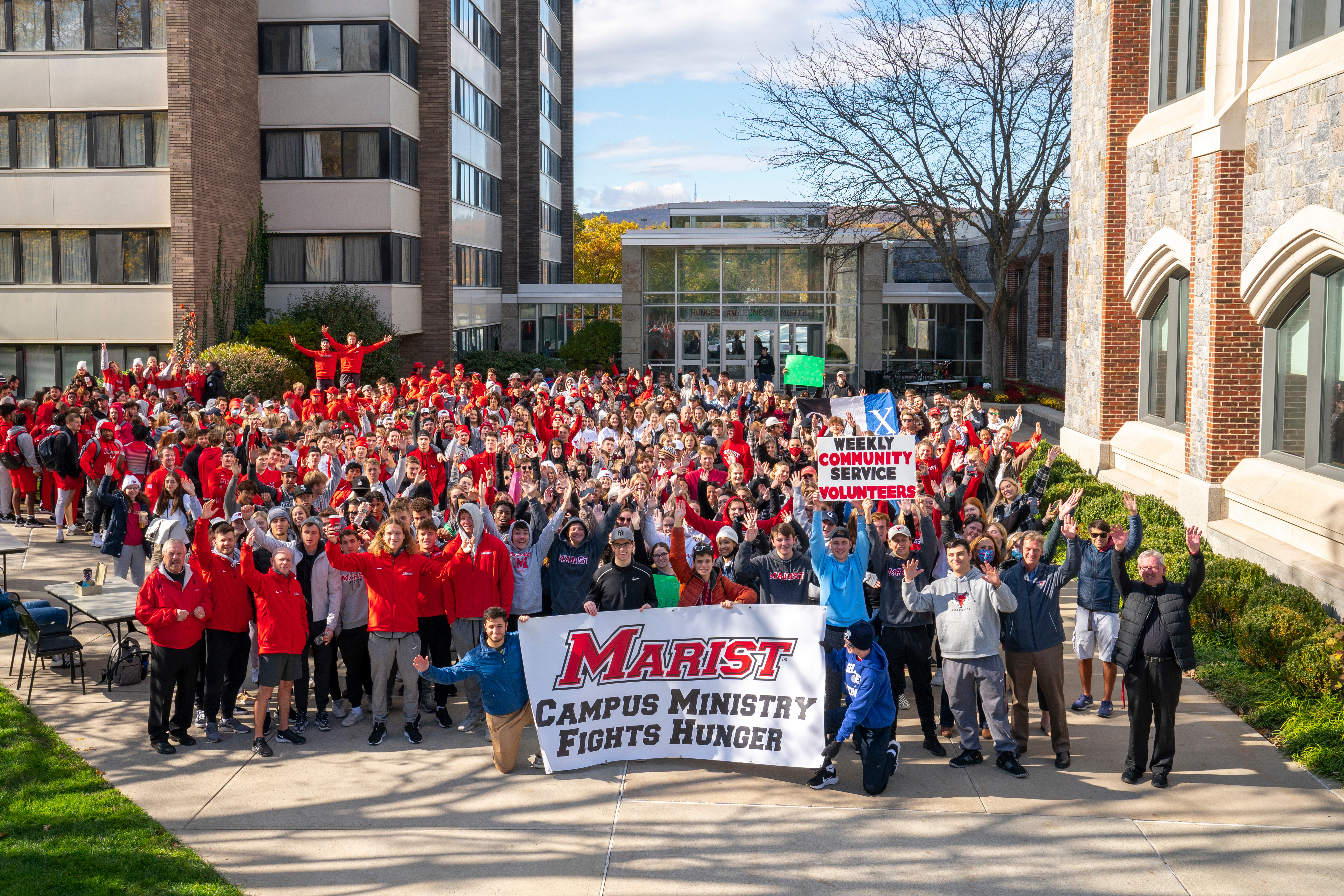 This image shows a large group of students gathered for the start of the annual Hunger Walk at Marist.