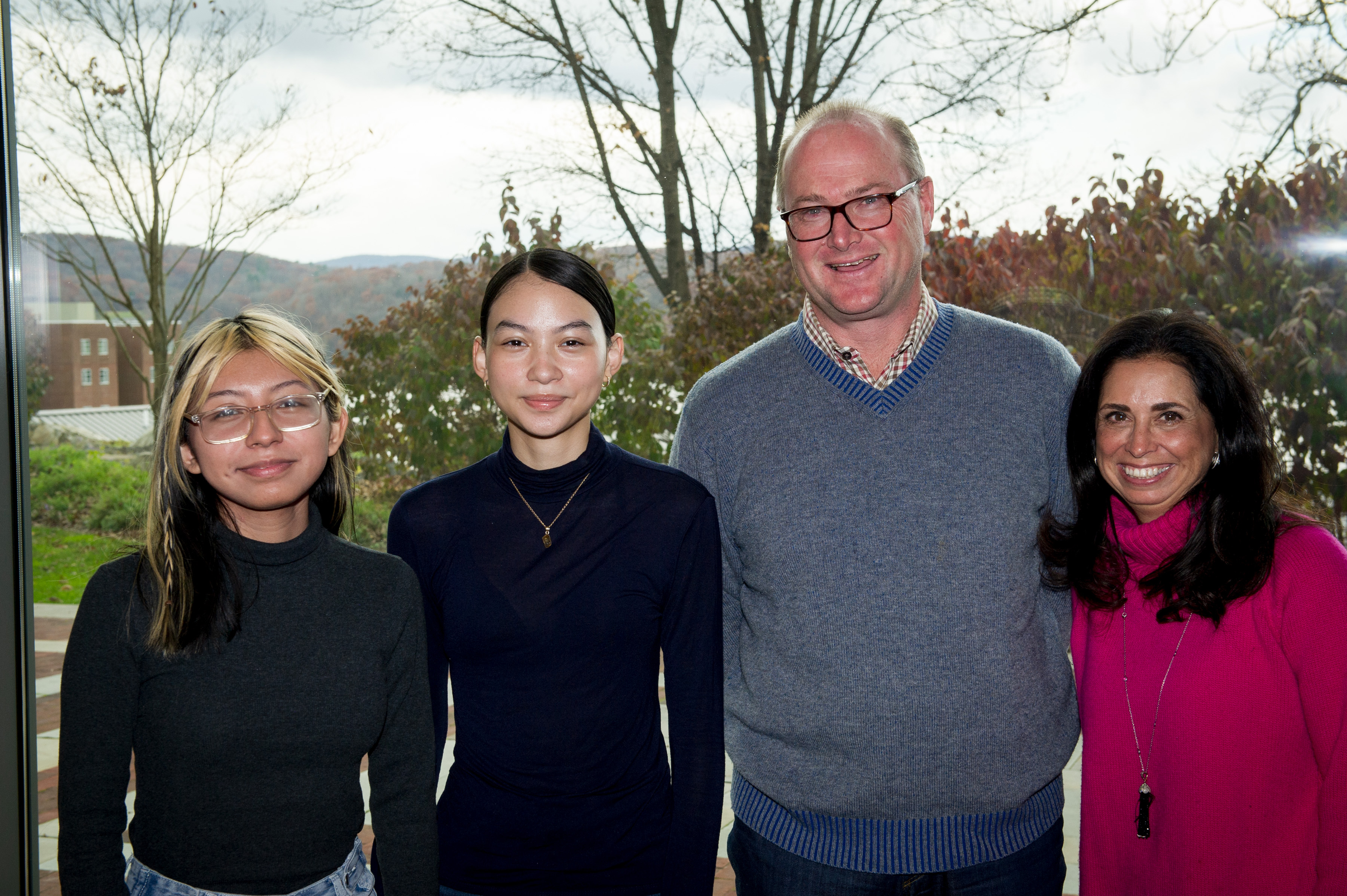 This image shows first-year Marist students Elisabet Guerrero Hernandez (left) and Harumi Kameda (second from left) who have been selected to receive the newly established Gilder Lehrman Institute of American History Scholarship at Marist College, funded primarily by Marist Trustee Genine McCormick ’88 (far right) and her husband, Michael ’88 (second from right).