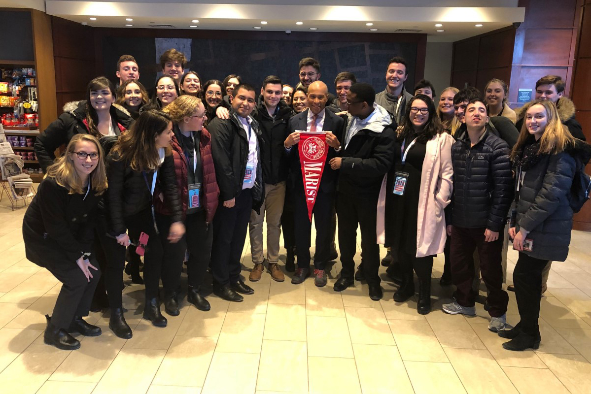 This is an image of Marist Poll workers with former Massachusetts Governor Deval Patrick during their trip to the New Hampshire primaries in February 2020.