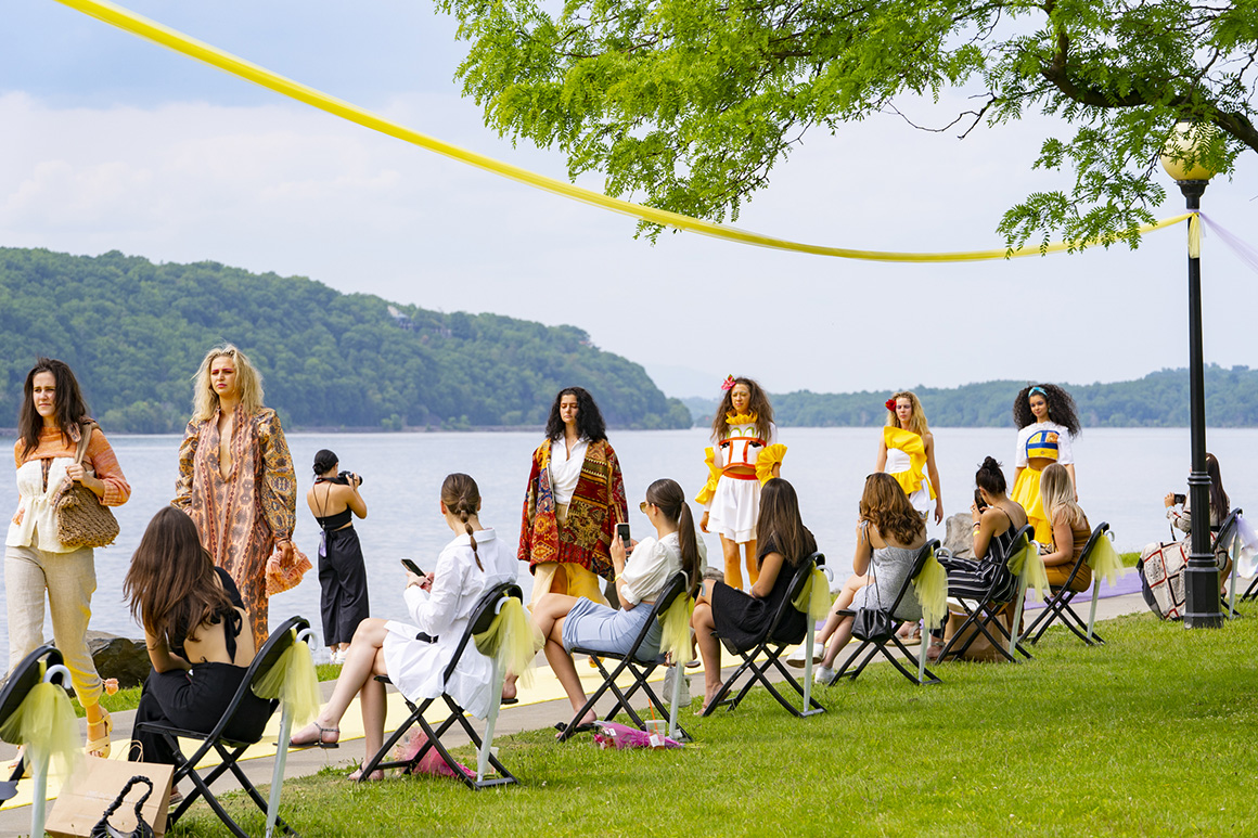 This image shows the 2021 Silver Needle Runway Show, which took place along the riverfront.