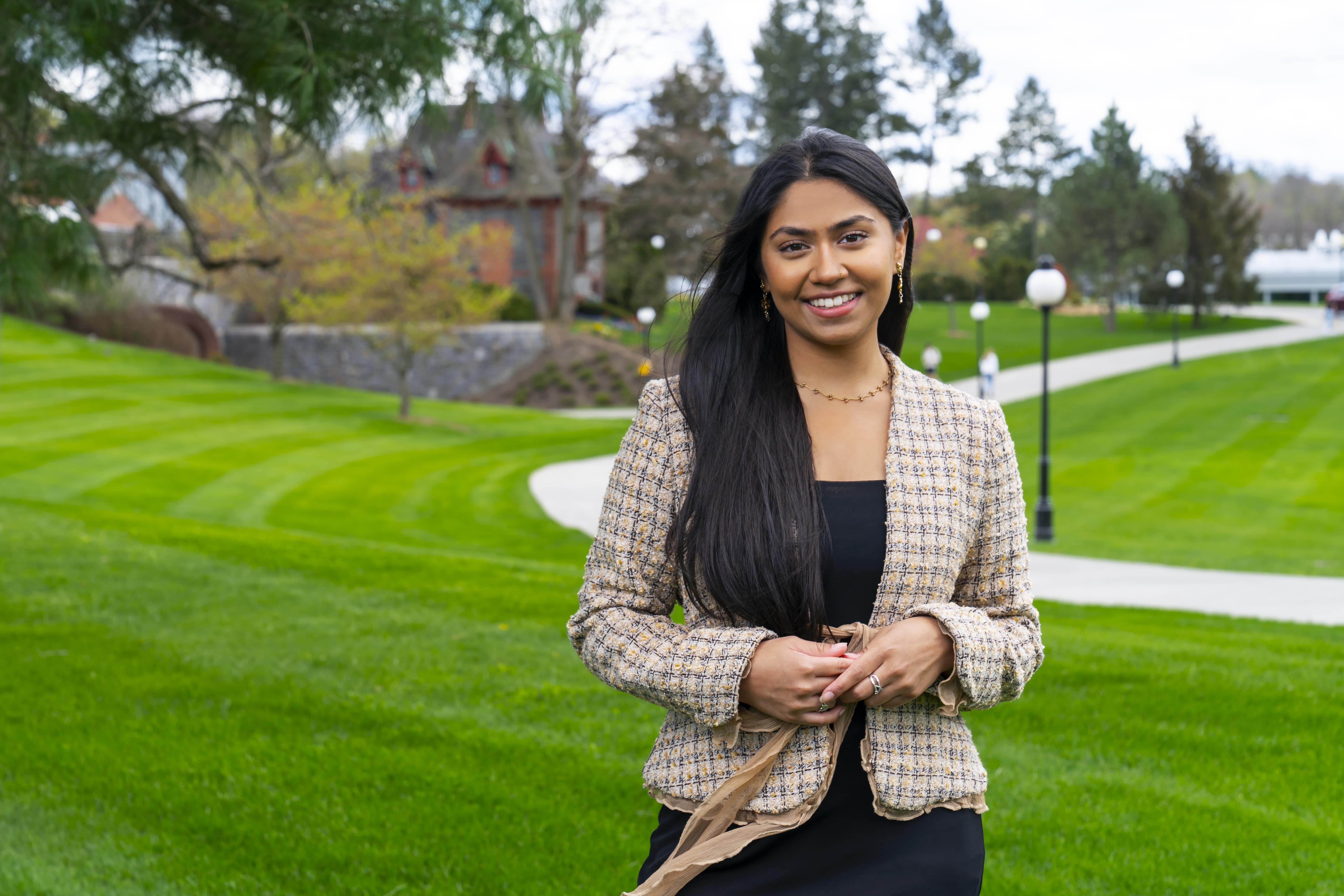 An image of Shivani Patel, a Marist 2022 graduate, in front of the St. Peter’s building which is home to Marist’s Upward Bound office. She was involved in the Upward Bound program at Marist.