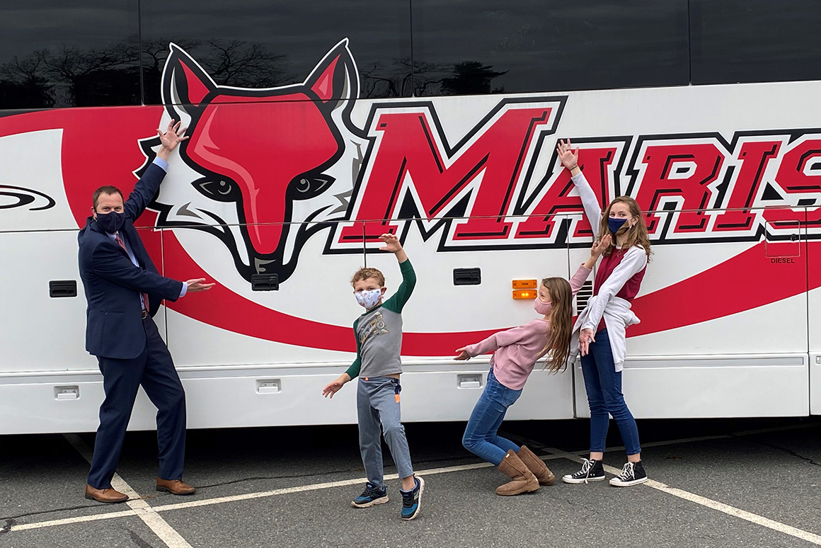 Chris, Tiernan, Anya, and Acadia Webb welcomed the Marist bus to Avon Old Farms School in Avon, CT, in fall 2020. 