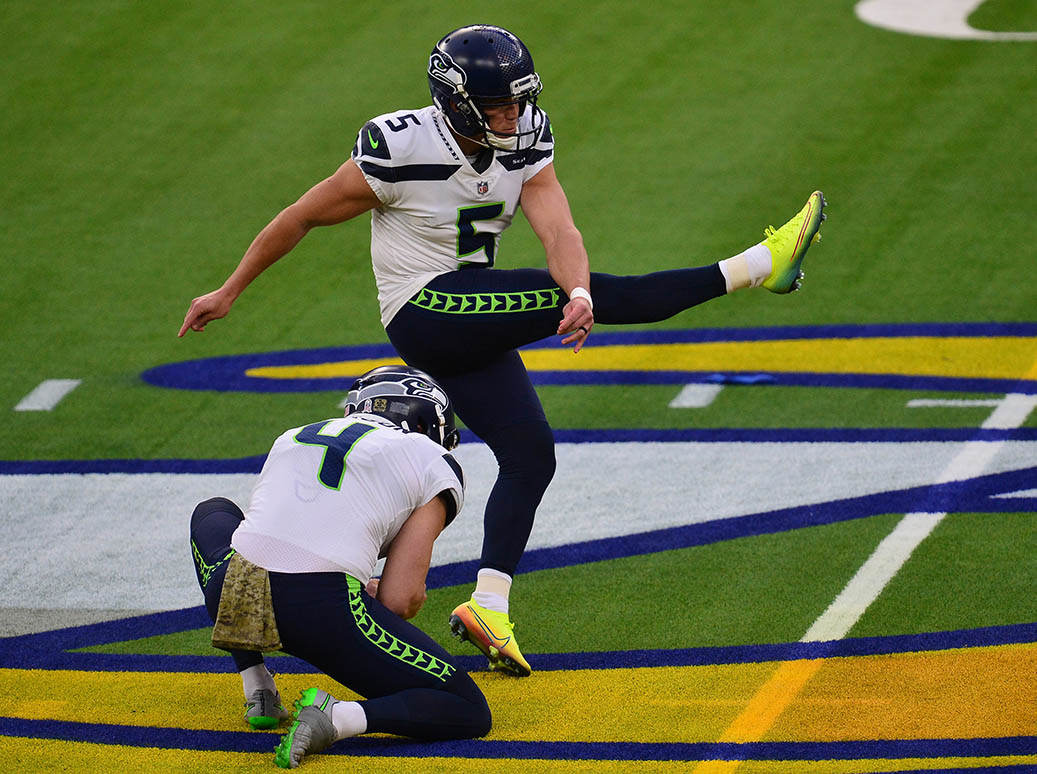 An image of Seattle Seahawks placekicker Jason Myers ’13 kicking a football